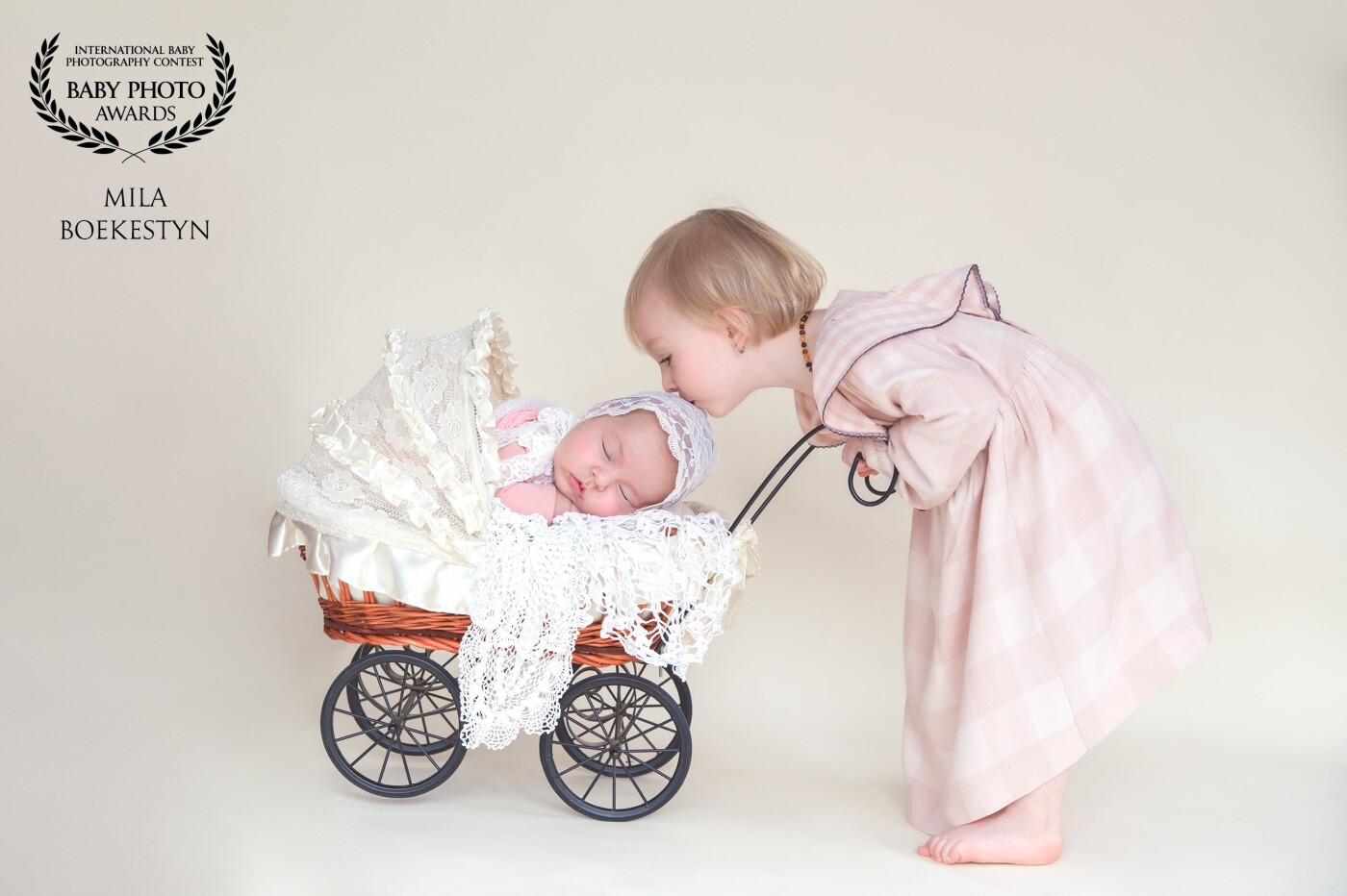 "Sister's love"  <br />
This baby girl was already 2 months old during the photoshoot, but she was sleeping better than any newborn and her big sister is only 18 months old herself was very  gentle and cooperative.  "Kiss your baby sister" and so she did!