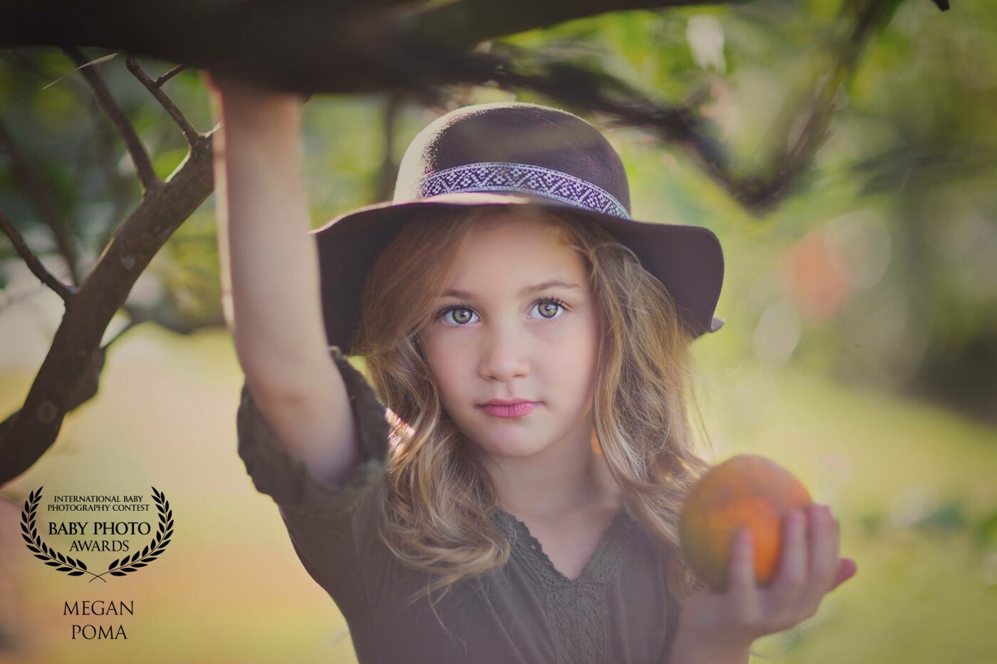 This photo I had the please of taking was of my beautiful daughter Kymberlie. <br />
It was taken In our backyard under our lovely  orange tree.<br />
A beautiful moment captured in time ❤️
