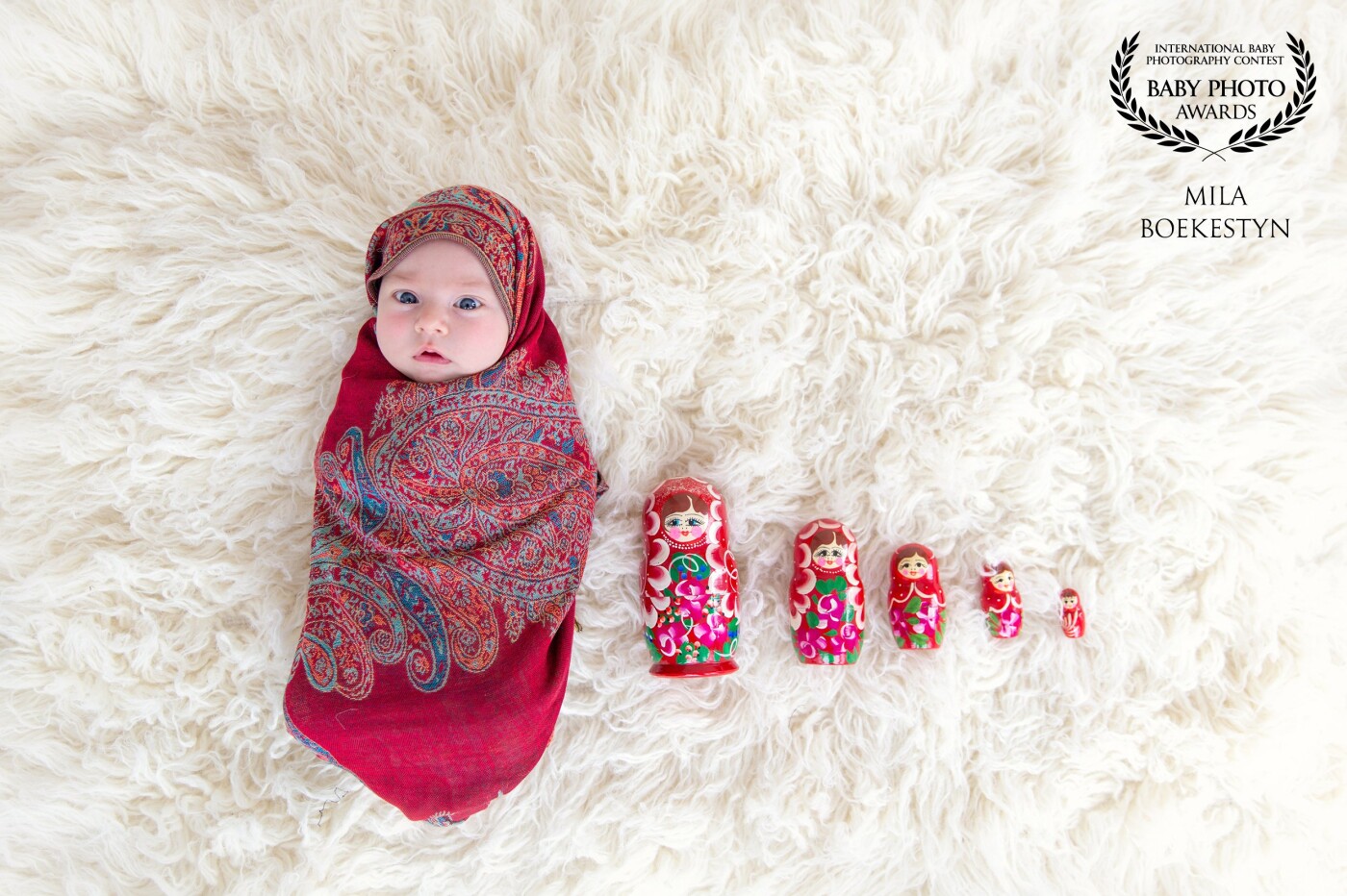 "Matryoshka". I had this image in mind for a very long time... I am originally from Russia and the name of my business - Milashka Photography is a loose translation from Russian as a “cutie” or “sweetheart”. This image of "Matryoshka" aka "Russian doll" is a perfect combination of my background and the name of my business and of course it is always great when you have a super adorable and cooperative newborn that looks right at the camera at the right moment!