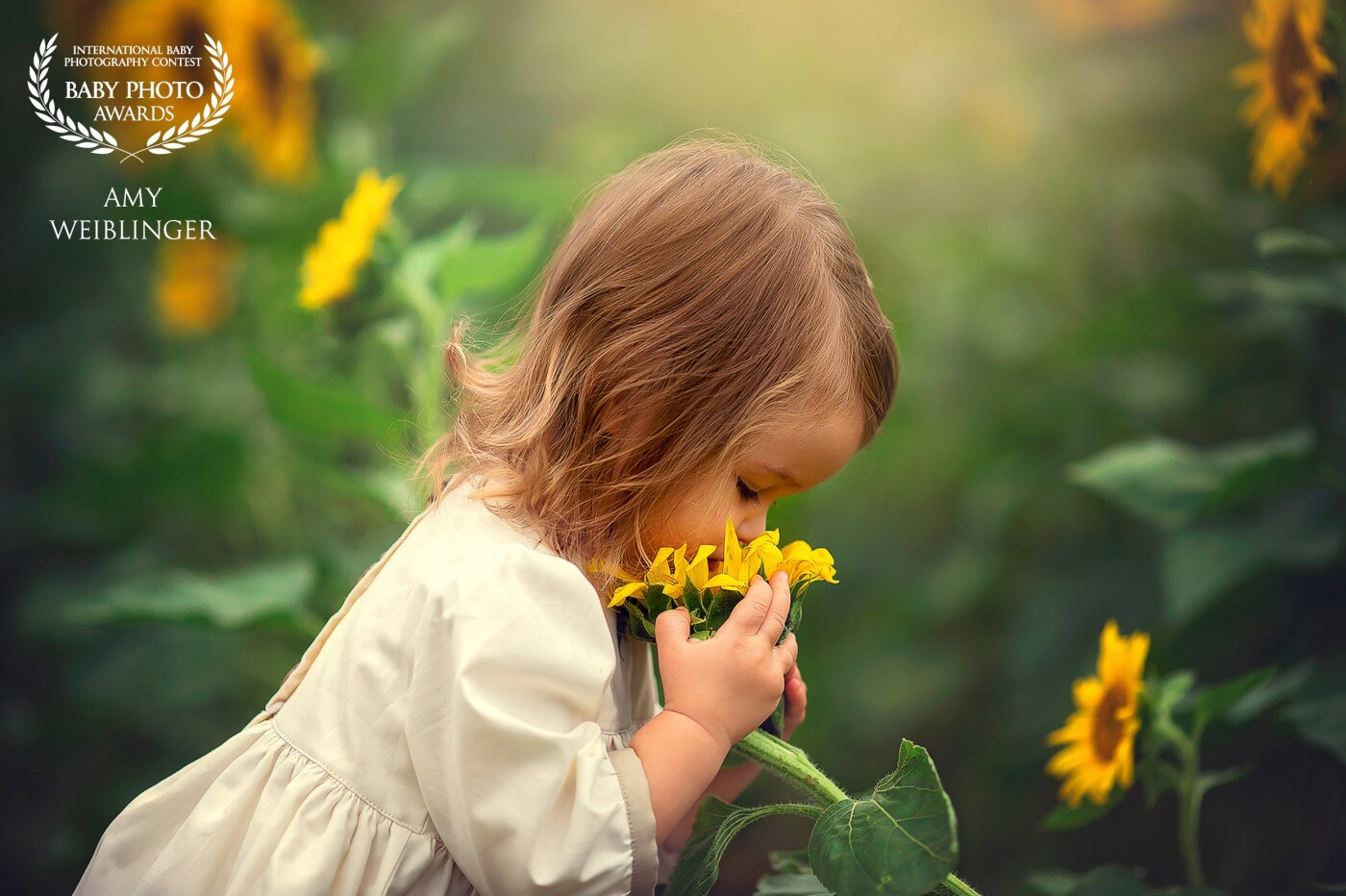 My baby girl adores flowers, so I was very happy to capture this sweet moment of her enjoying something that she loves in nature. 