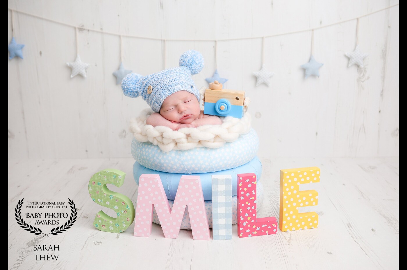 How cute is this little chap! He was a dream to work with and Mummy loved the idea of adding a camera and SMILE into the shoot, my sister bought me the camera as a gift!  <br />
Love working with new ideas. <br />
sarahthew.co.uk
