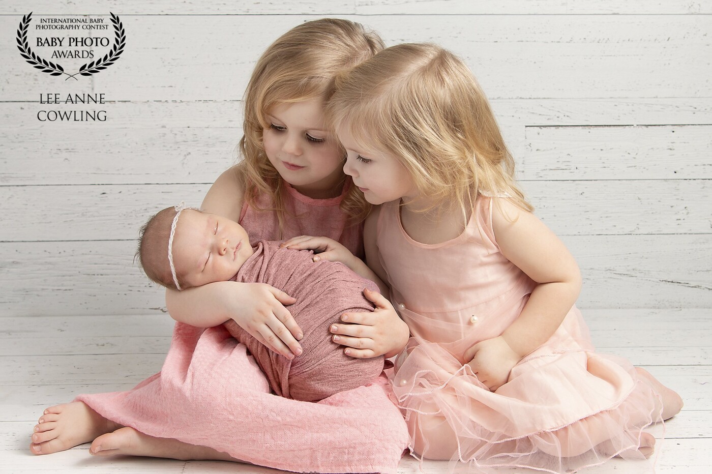 Perfection in Pink! It was a pleasure to capture this sweet tender moment for mom as these girls admired their new baby sister! 
