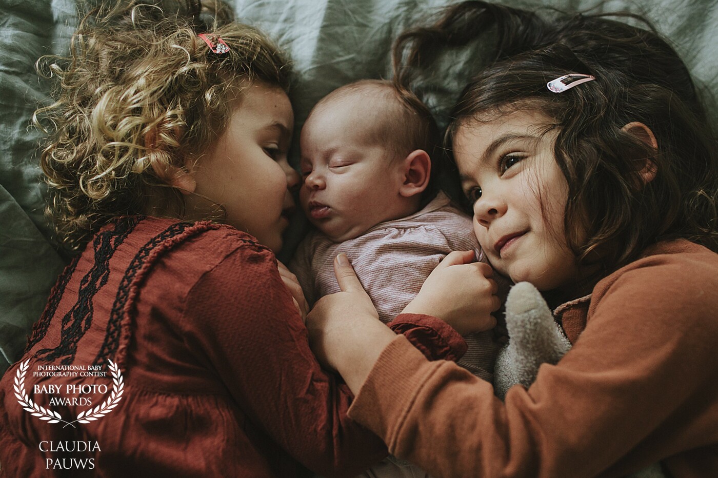 The parents of these three lovely girls had been waiting in suspense for their newborn baby. Because of complications that arose during the birth of one of their older daughters they made sure to enjoy the wonderful small moments with their children even more. It's wonderful to see how tender these girls are towards their baby sister! 