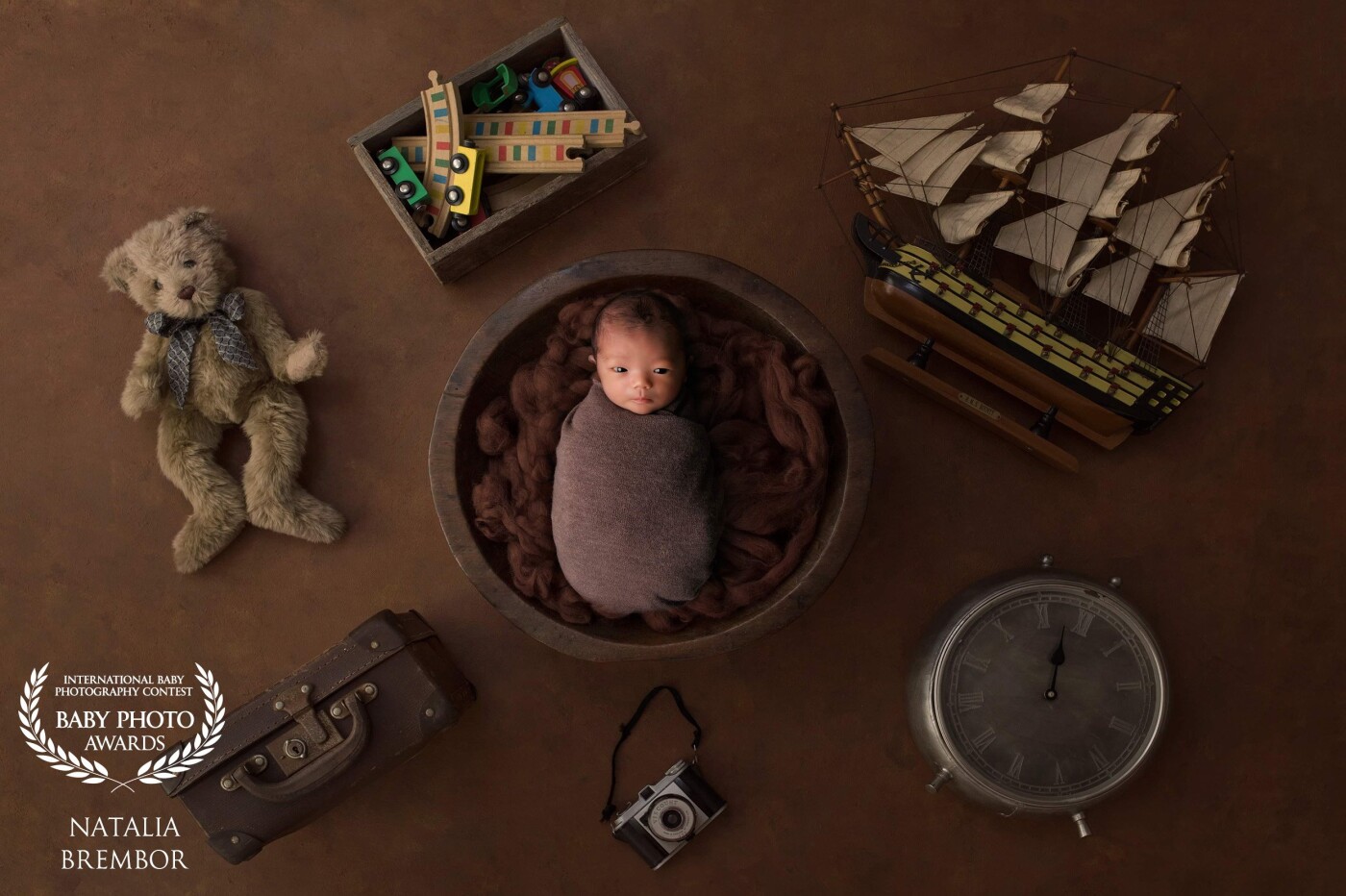 " A new baby is like the beginning of all things - wonder, hope, a dream of possibilities ". For this session, the Mom has chosen brown color, trains, boats and teddy bears. I could deliver everything she dreamed of with this beautiful scenario. Love my job :)