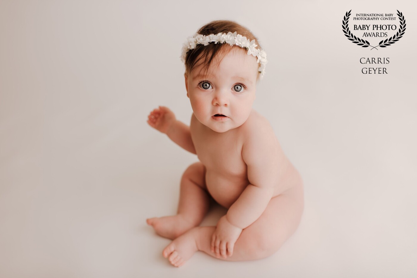 Beautiful baby girl photographed on on white seamless background with gorgeous white halo. This beautiful girl was an absolute dream to photograph so smiley and happy to look at me while I photographed. I absolutely loved the shot and so does her mummy more importantly :)