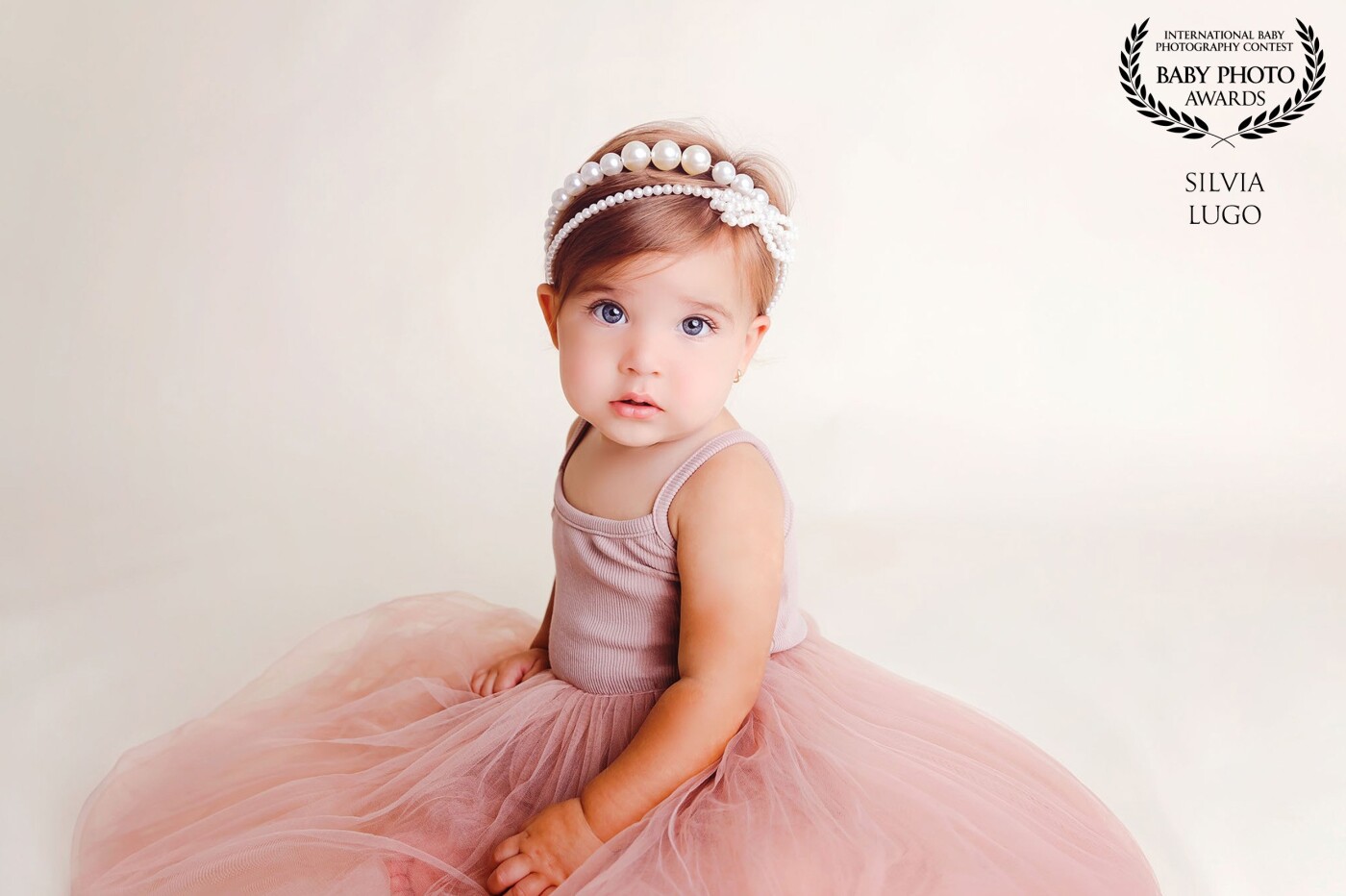 Baby Pearl has the perfect name, her beauty reflected and shine with pure simplicity and radiance like a true pearl.  My focus on her session was on her eyes and per mom's request, I kept it as simple as possible to bring all her beauty as the main focus of her first birthday session.  I loved how a pink pearl feels shine throughout her session.  One of the best parts of portrait photography is to get the most of an image you need less to work with.  I used one light source to keep contrast and texture on my image, and it worked perfectly. 