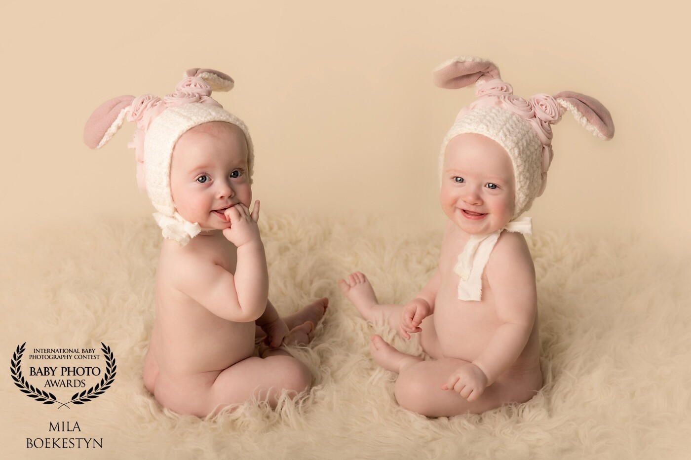 I have been photographing these 2 bunnies since they were born and this was their "Sitter" milestone session, where they were almost 9 months old.  The twins although identical, have very different personalities and it is so much fun to see them grow.  This specific image was a composite of 2 images of each individual sister separately as sometimes it is hard with twins to get them awake and happy at the same time - so when one was napping I was taking pictures of the other one.