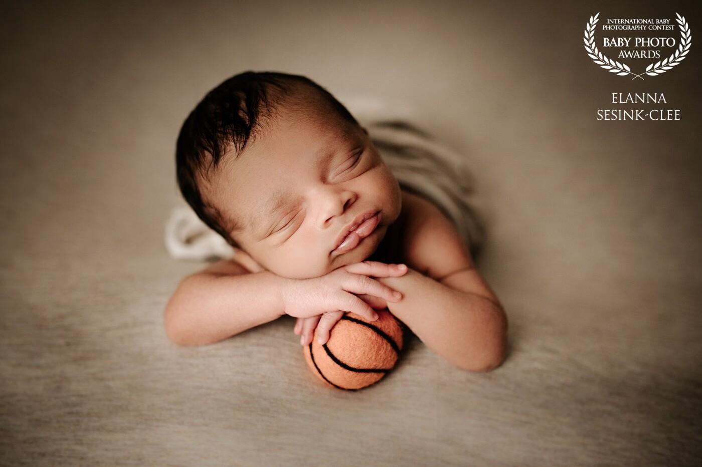 This baby boy's mom and dad were both basketball players in their past and wanted to showcase that in one of their images.  Little Cairo was absolutely a dream to work with and we had no trouble pulling off this pose!