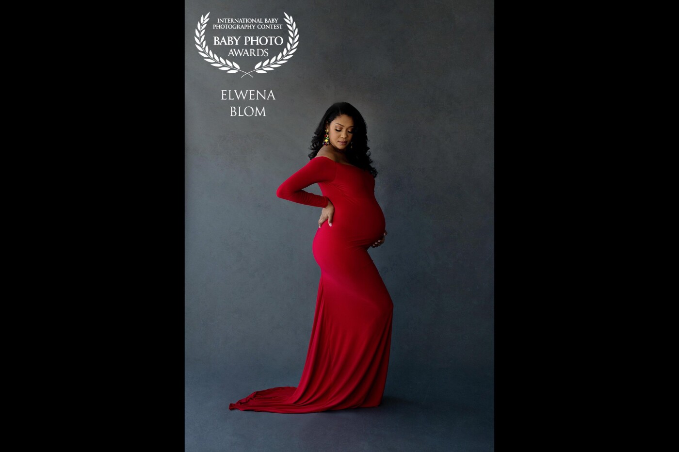 That red dress just takes everyone's breath away, especially against the dark background. This gorgeous mom is as bold as this dress and was just as breathtaking.