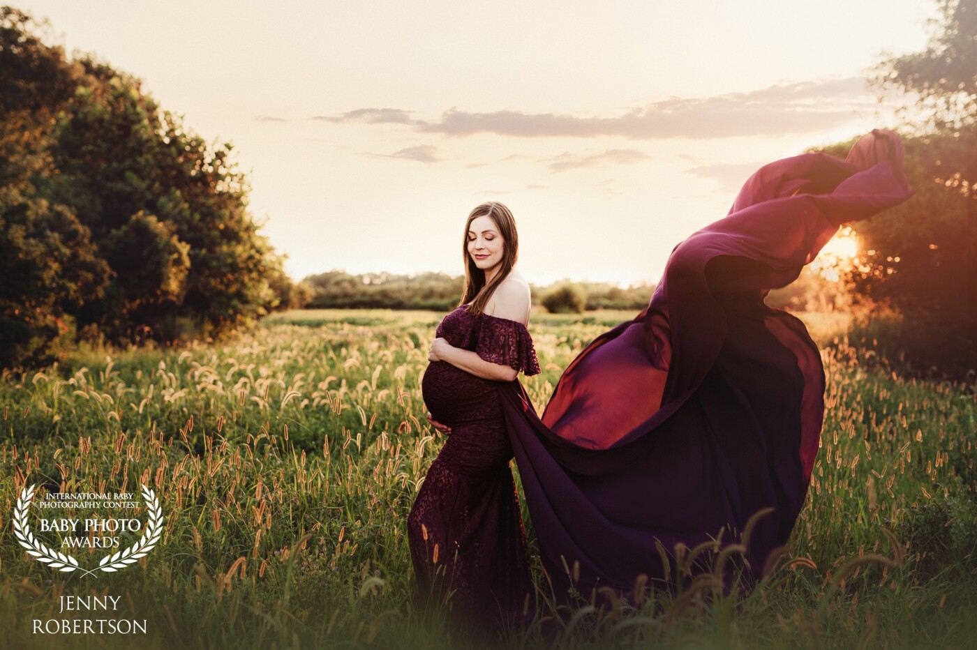Sunset maternity sessions in a Kansas field are so beautiful. This Momma nailed the pose while Dad had the perfect fabric toss! Our first session was cut short by storms but we made up for it with this amazing maternity session!