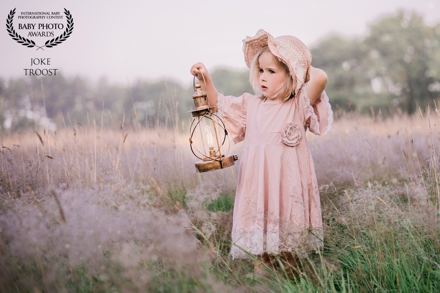 I saw the foggy grass on this field and knew I had to make some shots. The chance came when I got to photograph this little girl. With some clothes from my client closet the picture was complete.