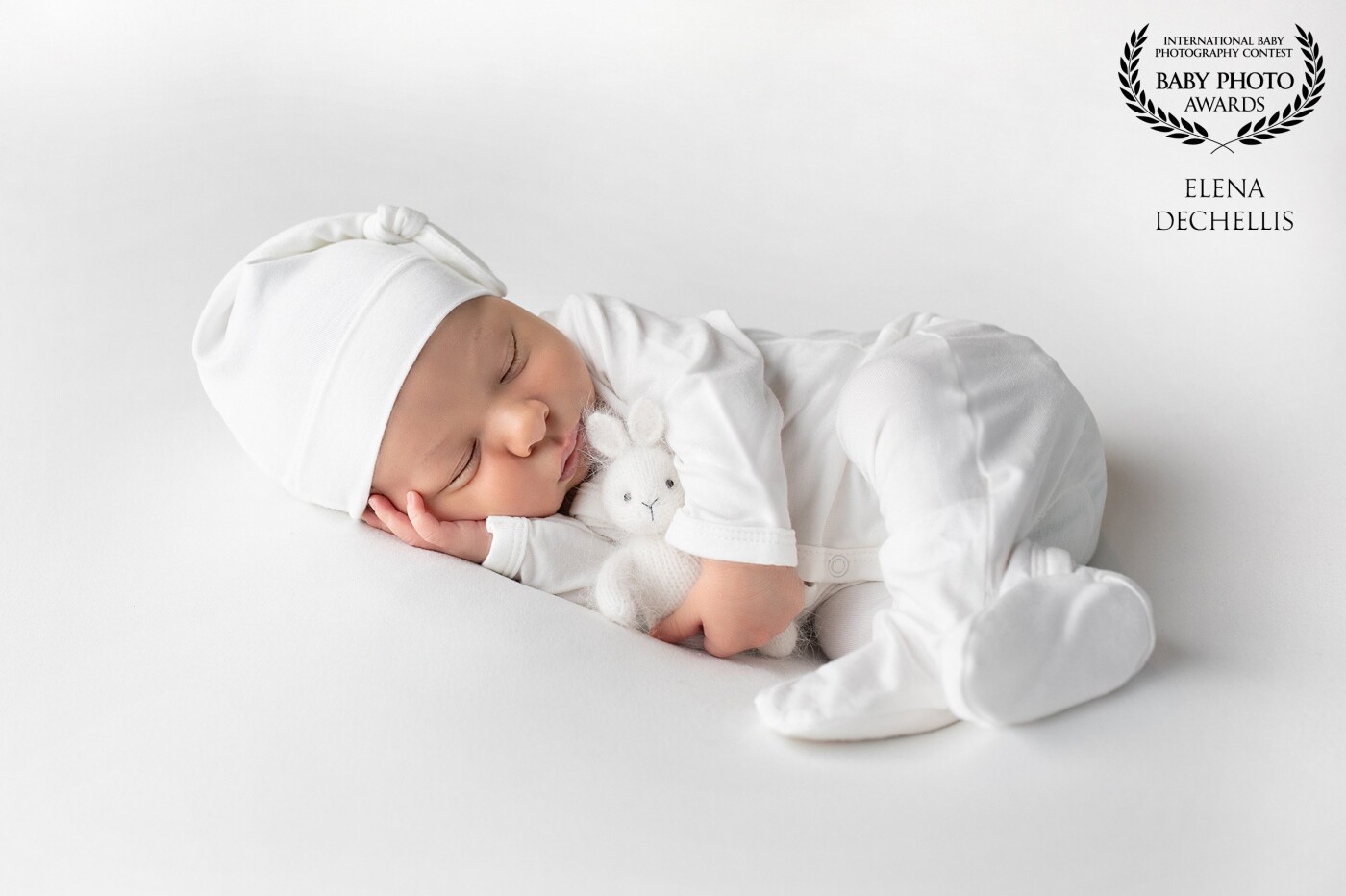I love keeping my newborn portraits simple without overpowering them with props and unnatural posing. White on white is always my go-to. I love keeping it clean, timeless, and minimalistic. It's all about the baby. 