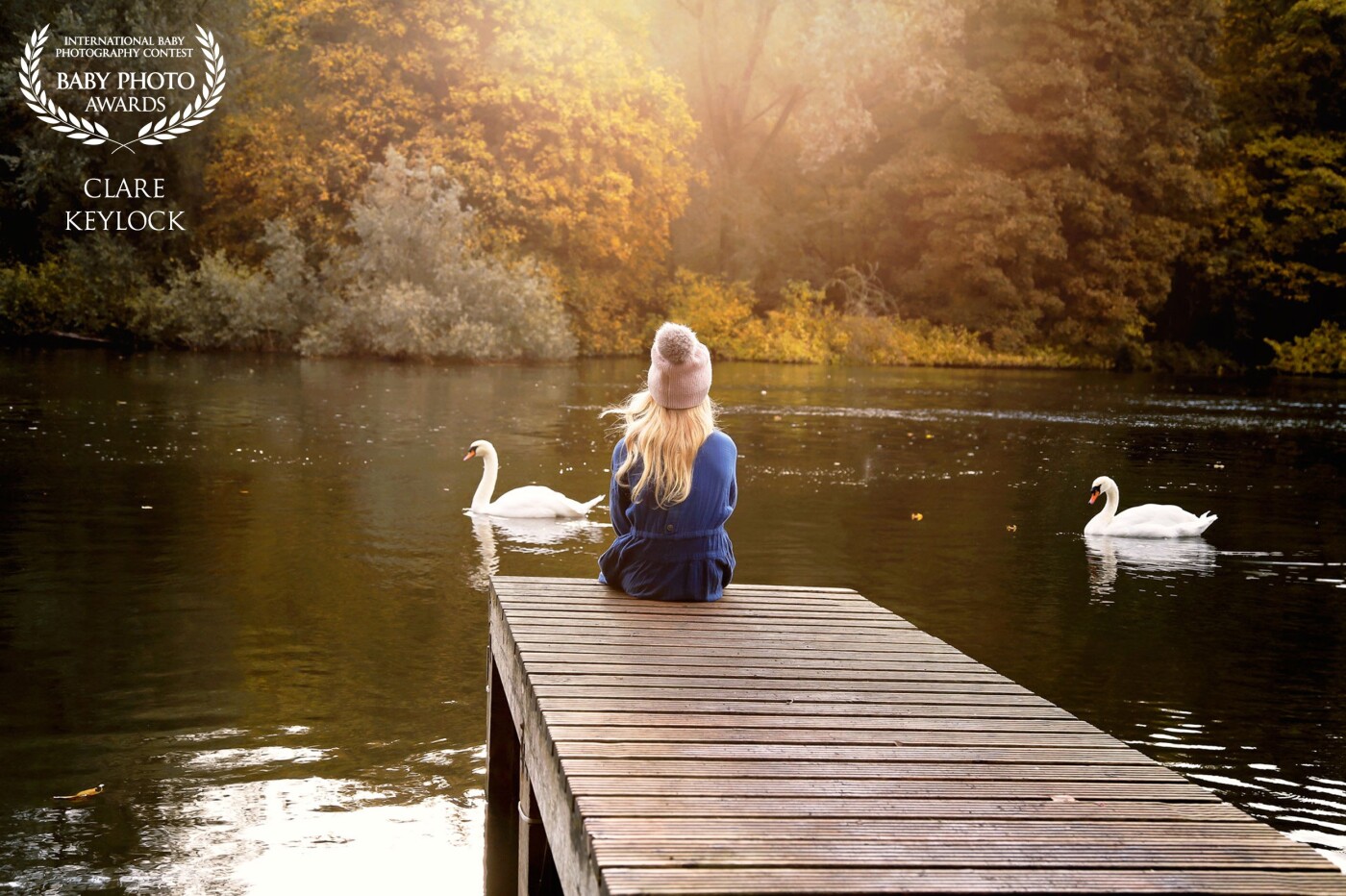 I had my eye on this gorgeous spot for a while to photograph my daughter. The light in the morning here is just stunning and the autumnal colors at this time of year are so beautiful. We were so delighted when these two beautiful swans came to see what we were up to. A really beautiful magical moment, one we won't forget.