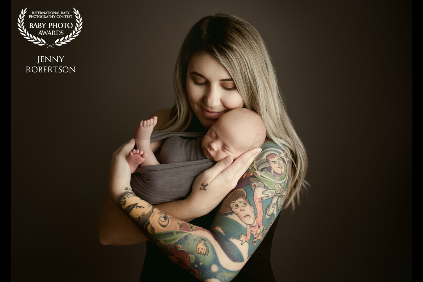 When this gorgeous Mom came to the studio for her session I happened to notice a little bit of her tattoo sticking out from under her shirt. I asked if I could see it and was blown away when she showed me the detailed Disney tattoo that was hiding underneath. I knew we had to feature it as part of the parent posing. I love how beautiful this image turned out. 