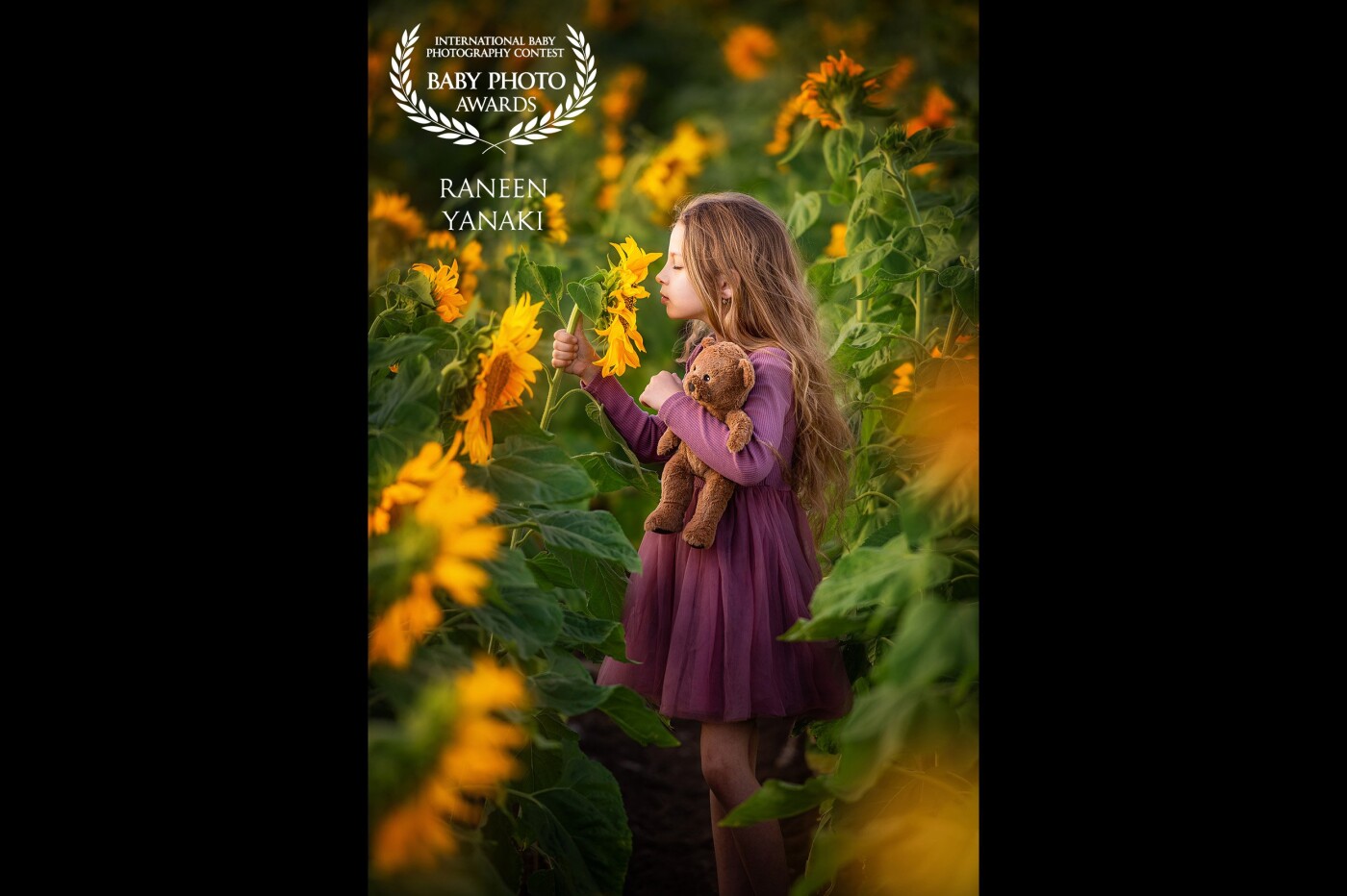 Lea and the sunflower... <br />
Lea is a nature lover and an amazing little model! <br />
She feels so comfortable in front of the camera and loves to be photographed in the beautiful nature.<br />
In this photo, Lea took a moment to herself and connected to the nature around her, and I was so lucky to capture this beautiful photo.