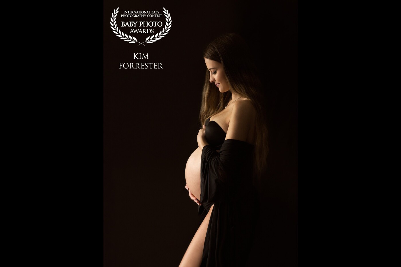 We get so wrapped up in preparing for a new baby that we often forget the transition a woman is going through, not just in creating the life inside her but in becoming a mother. I wanted to use light against a black scene to eliminate all distractions, and to highlight both the belly and the beauty of this mama-in-the-making.