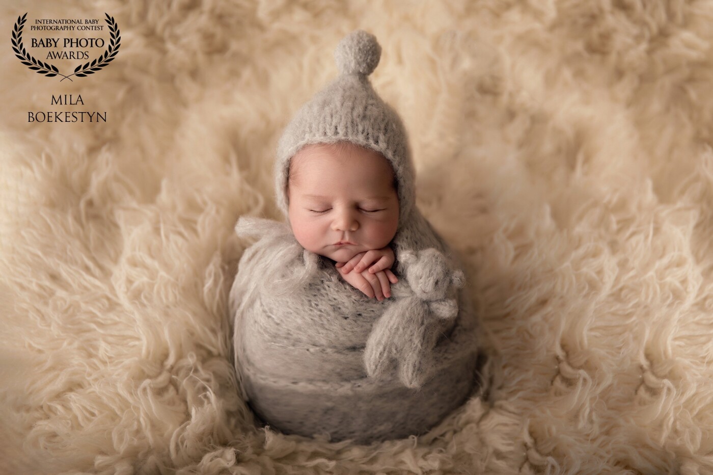 Absolutely love how this shot has turned out - baby boy wrapped and posed on a flokati and is it just me or does he look like a little Hershey kiss chocolate? So yummy!