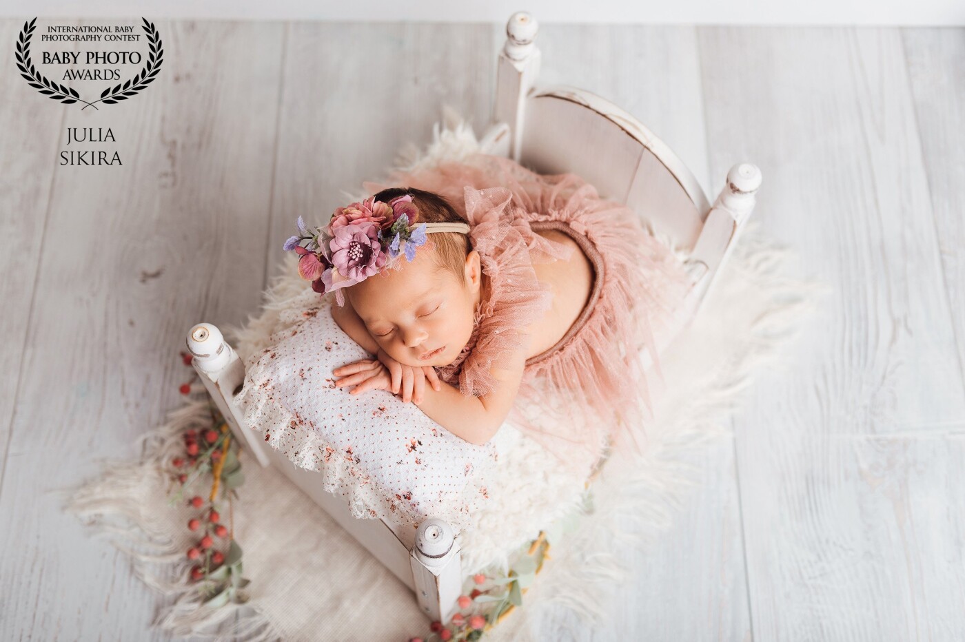 In this photo, you can see the sleeping little princess. For the set, I chose pastel colors like white, rosa, and violet. I also love the perspective in the photo.