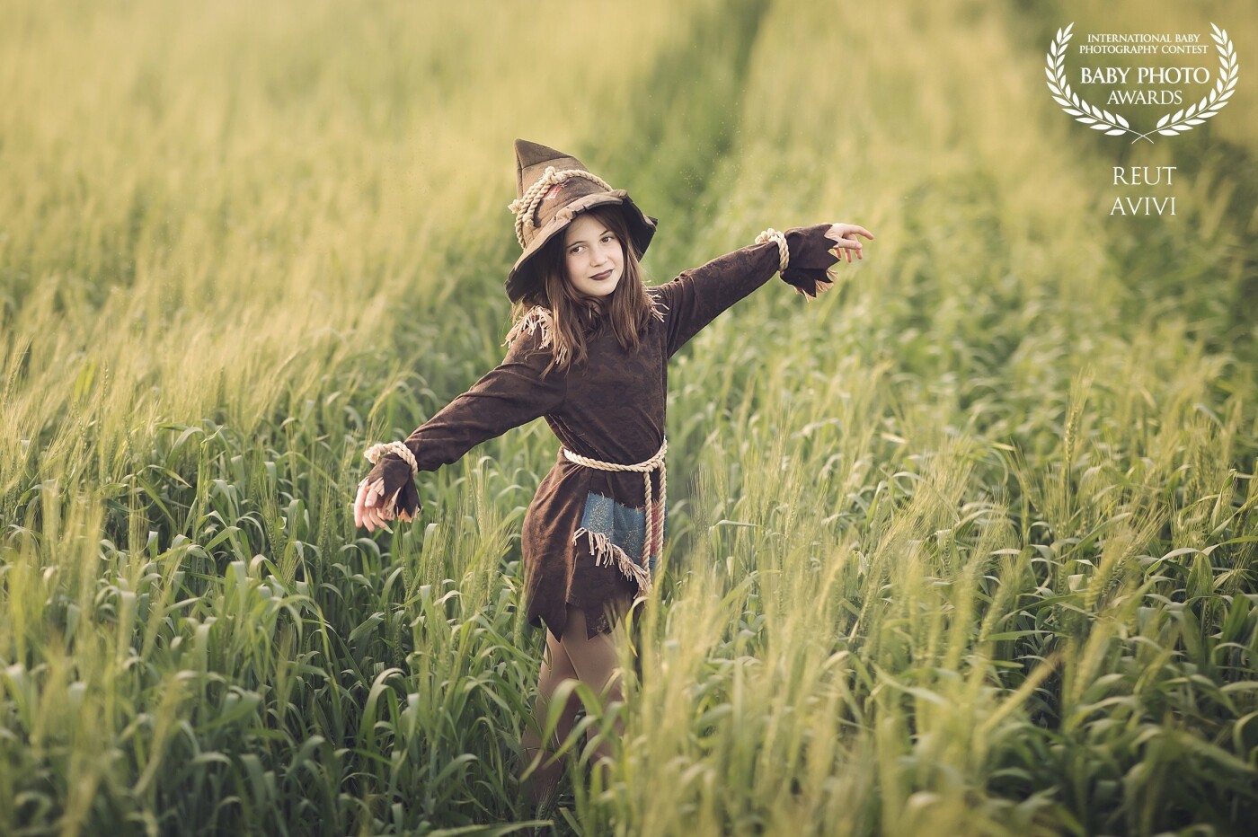 The most beautiful scarecrow I have ever met and I am biased because this is my favorite and regular model :) There is no more beautiful place to emphasize the colors in the picture than a green wheat field in golden time
