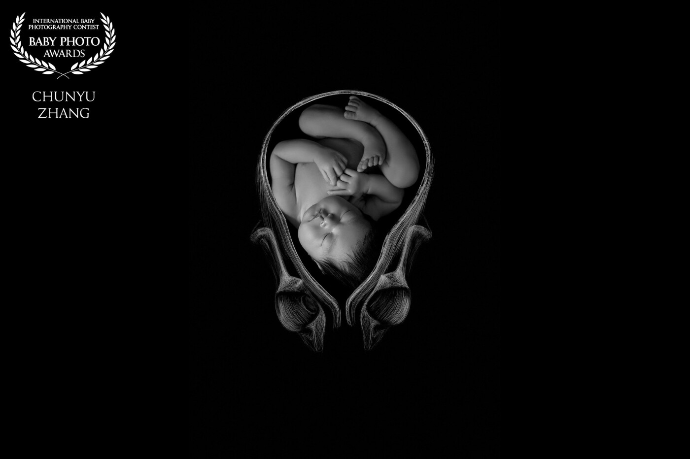 This is a picture of a newborn baby, which imitates the child's appearance in the mother's womb. The flower bud is used to simulate the womb of the mom, who protects the baby for a long and exhausting 10 months like the bud protecting the flower.