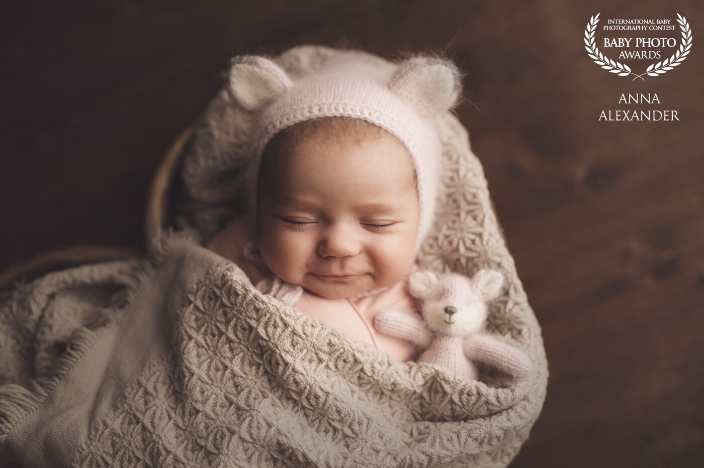 There is nothing cuter than a baby's smile. I love when I manage to capture it. And nice props make it twice the fun. Little toys and knitted hats add interest and compliment the baby.