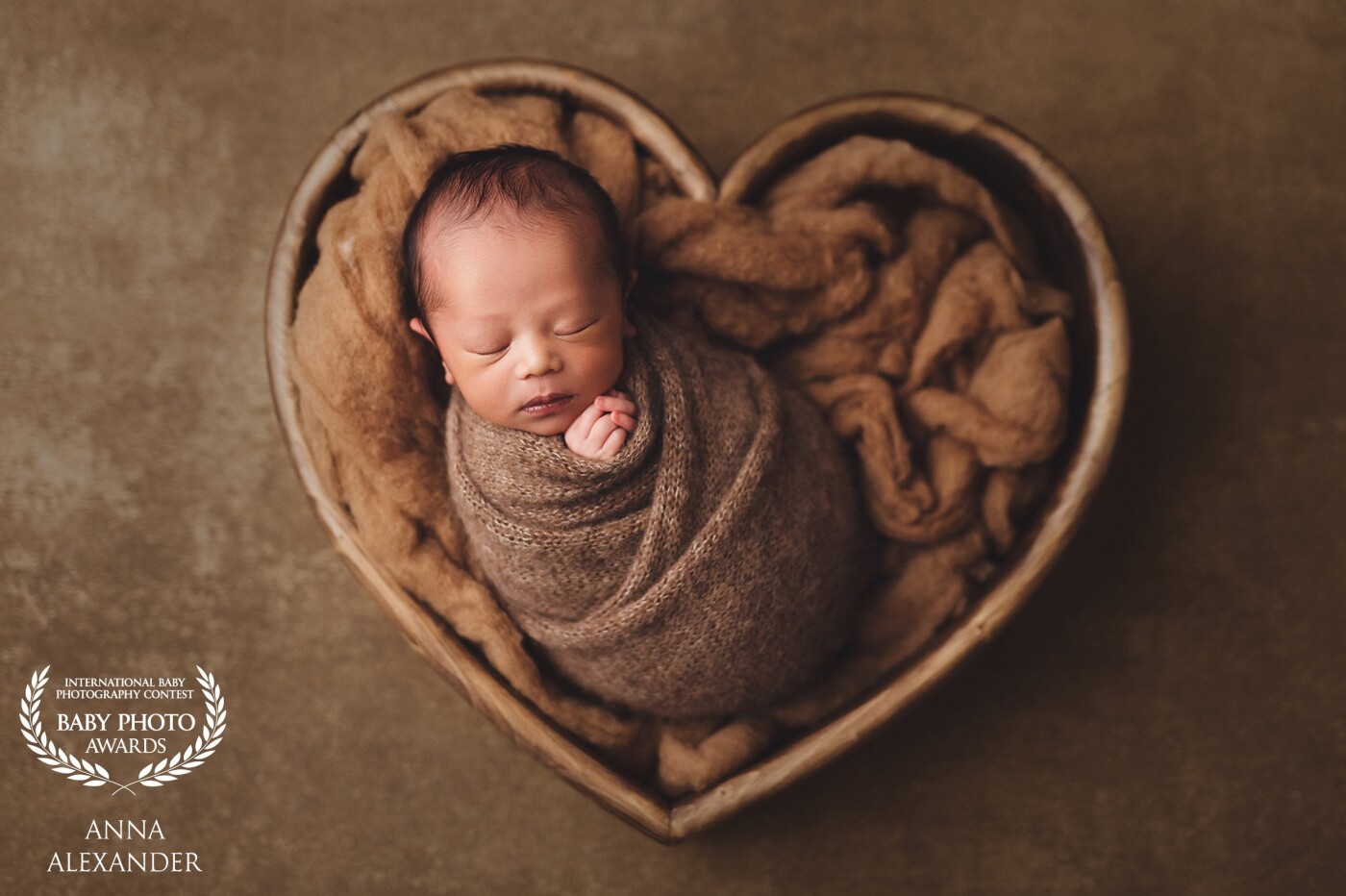 The cute baby boy was bundled up and so cozy. This simple but elegant heart prop speaks for itself and compliments the newborn portrait so nicely.