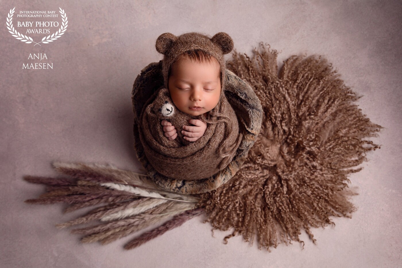 This is little Tudor at 12 days old. I really love the simplicity in this picture combined with the beauty of the baby...The natural colors in this picture are so flattering and make the baby stand out beautifully.