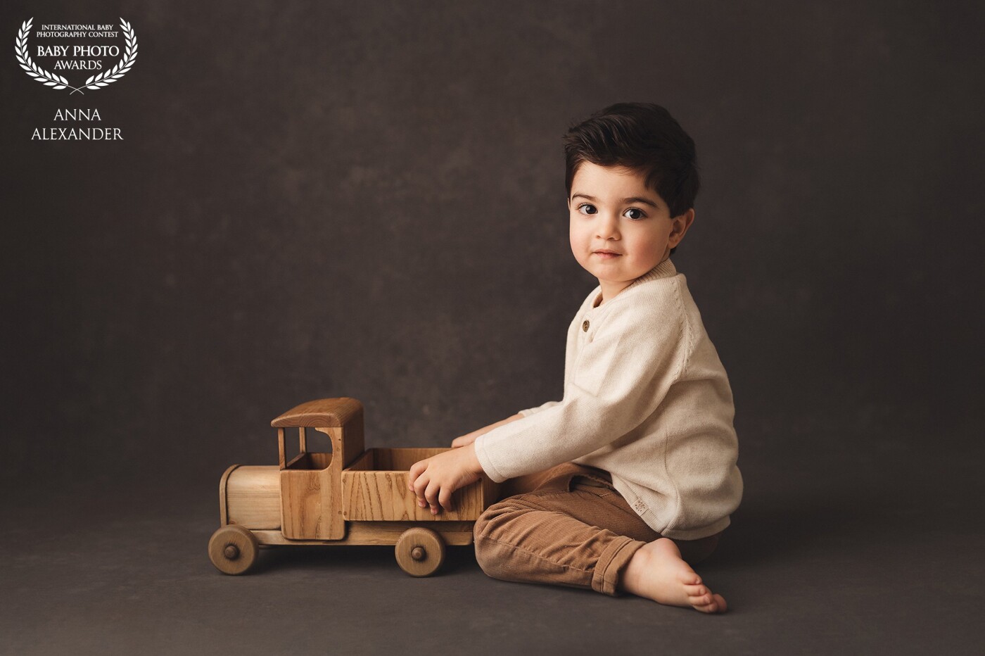 Newborns are growing and I love to capture every following stage. The boy and the truck for this one. Perfect combo. This truck was hand-made using my design.