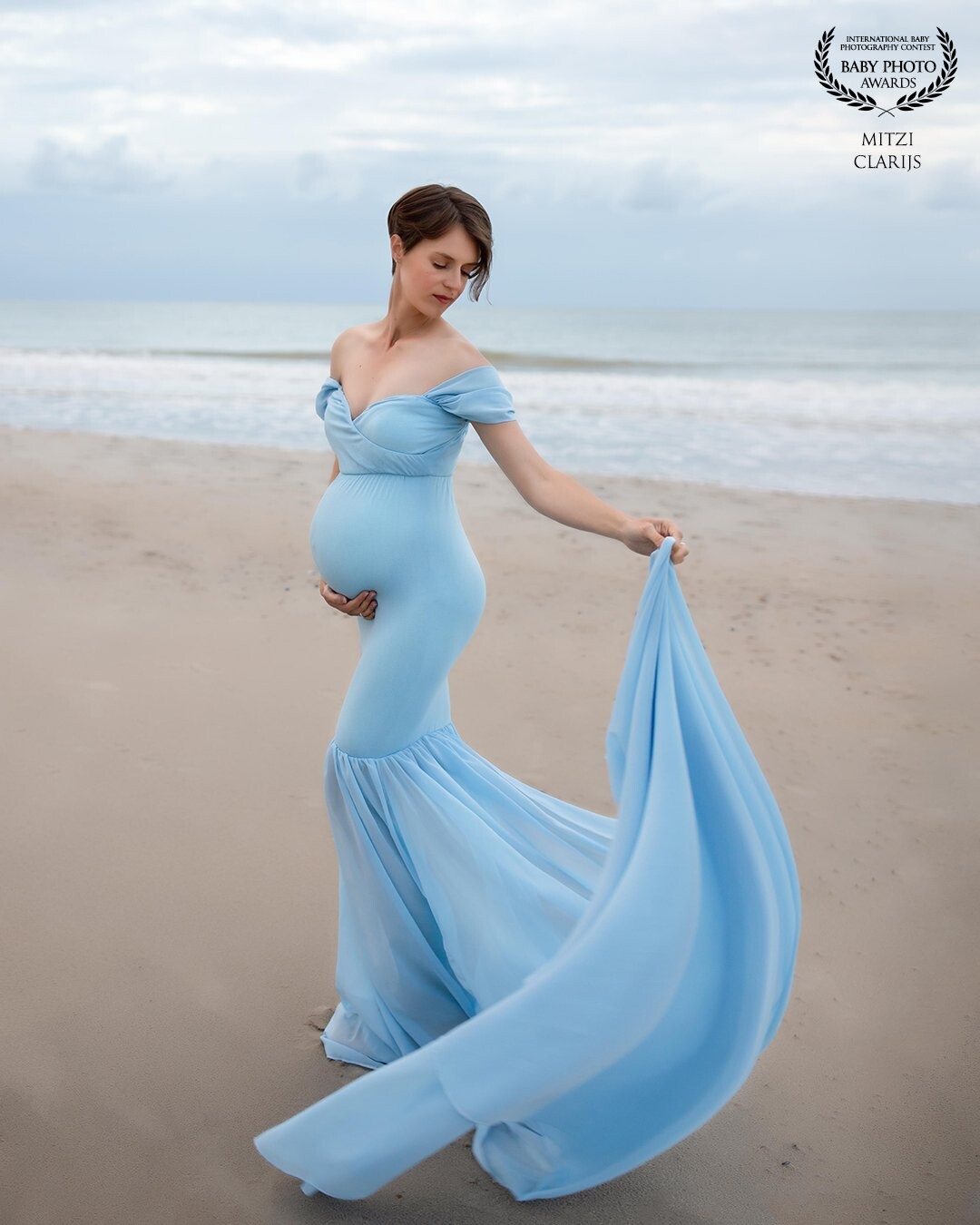 This gorgeous mom looks so good in this babyblue dress. She really rocked every pose, dress and picture of her shoot. I also love the color of the dress matching the sky full of clouds.