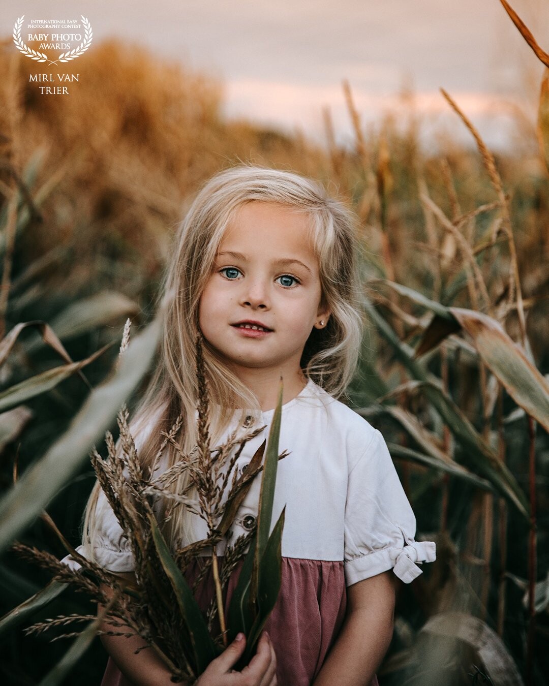 Olivia is a 5 year old girl. I was so lucky to get her as a model on a farm, right when the sunset started happening. She just has this natural beauty all over her.