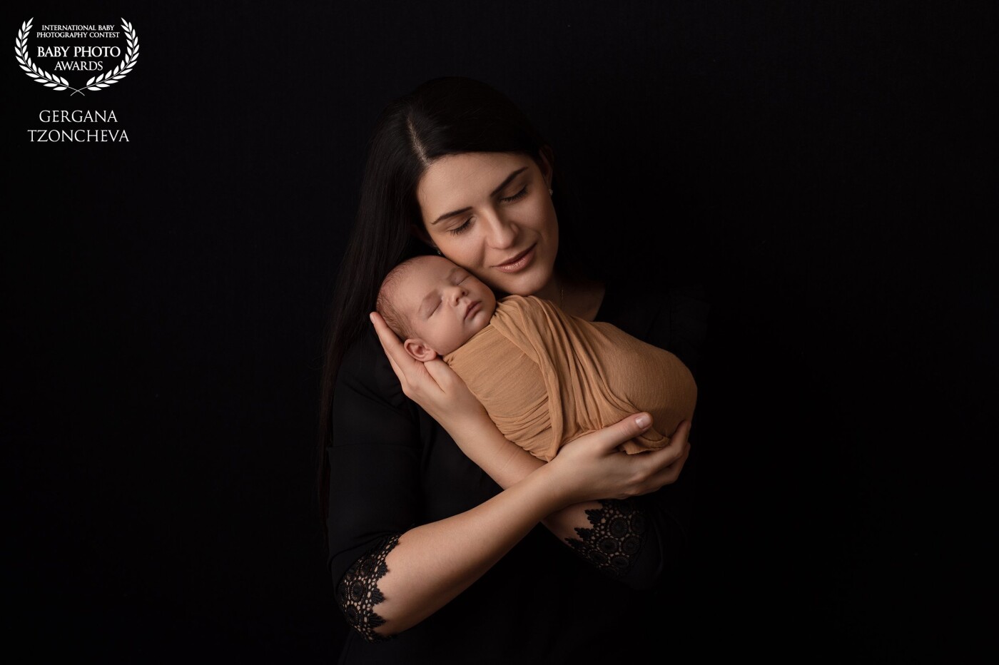 There is so much tenderness in this image. Whenever I ask mom to hold the baby like this, I don't even have to direct her to close her eyes -  the subtle smile and the gentle expression just come naturally.