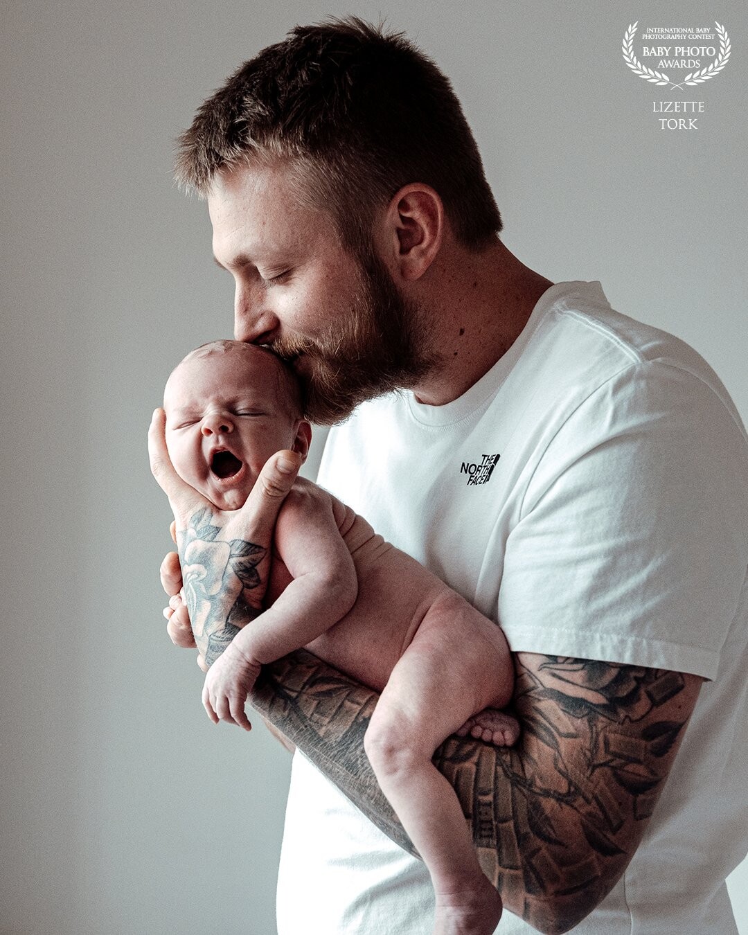 I usually focus on mothers with their newborn babies. Often I eventually get the father to participate in the lifestyle shoot. This picture is a perfect capture of this tough father who is super proud of his son. I am very proud of this photo!