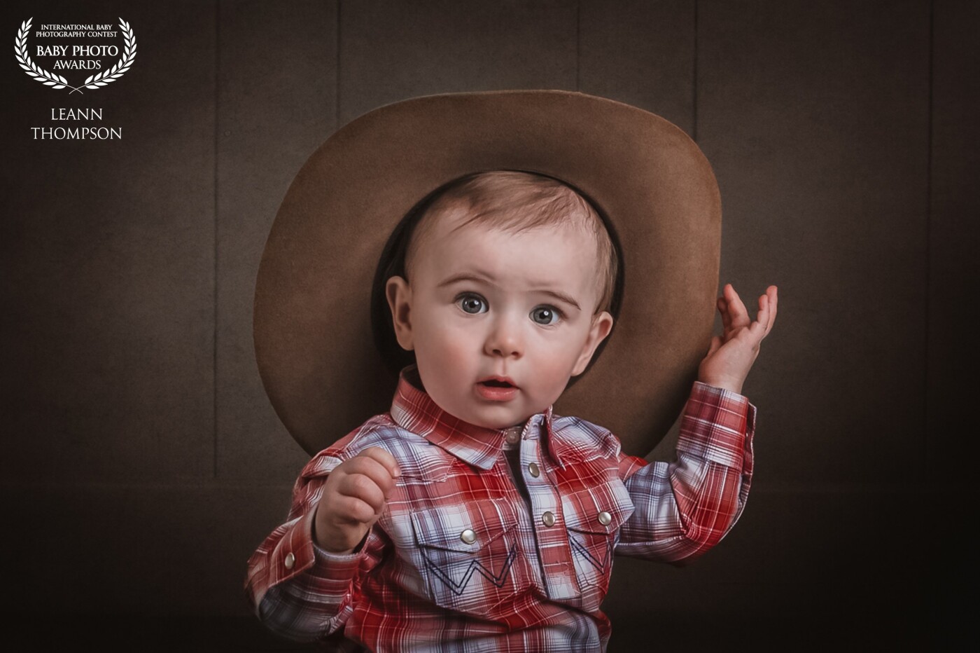 It's not easy being the cutest cowboy around..<br />
For his first birthday his gigi brought him in for some rodeo shots,<br />
who knew he would dazzle the camera like he did with those big cowboy blue eyes.