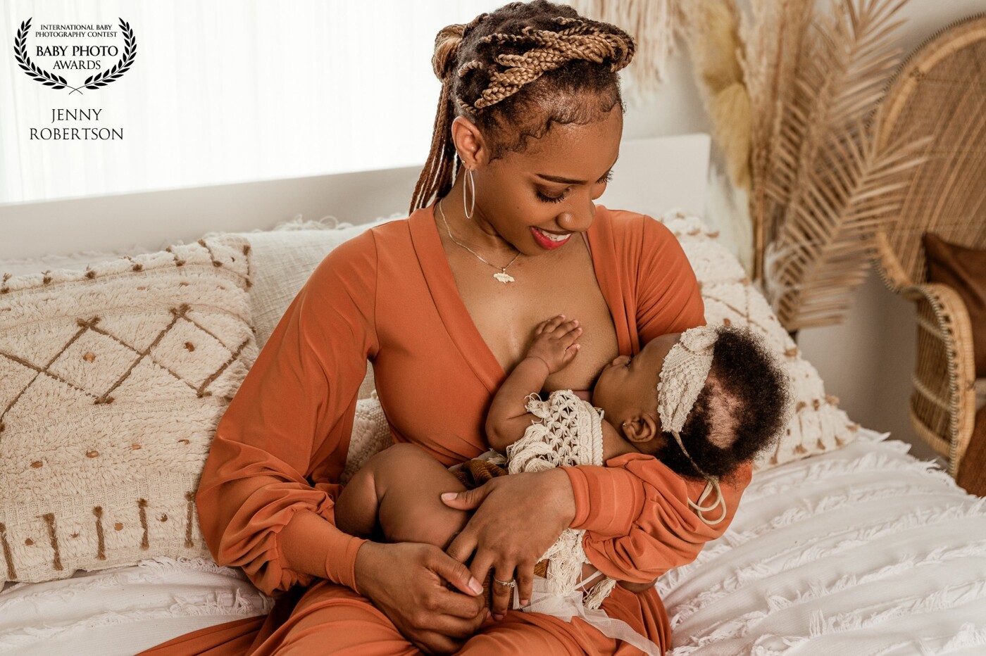 This photo was taken when baby got fussy during our photoshoot. We just kept on shooting to capture that connection between mother and baby while nursing. I just love her little hand over mammas heart.