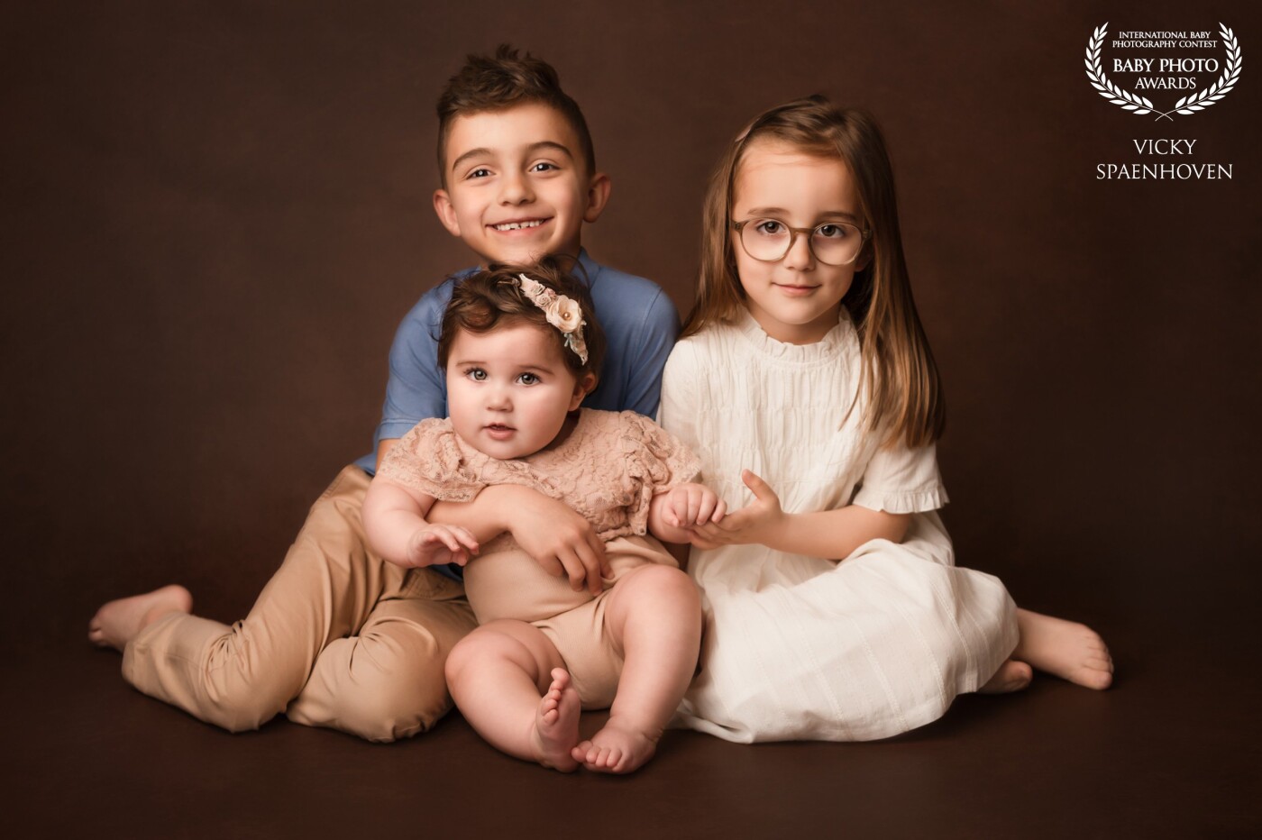 This beautiful boy has brought his two lovely sisters with him for a timeless portrait. I absolutely love the warm tones in this picture and the beautiful connection between the kids.