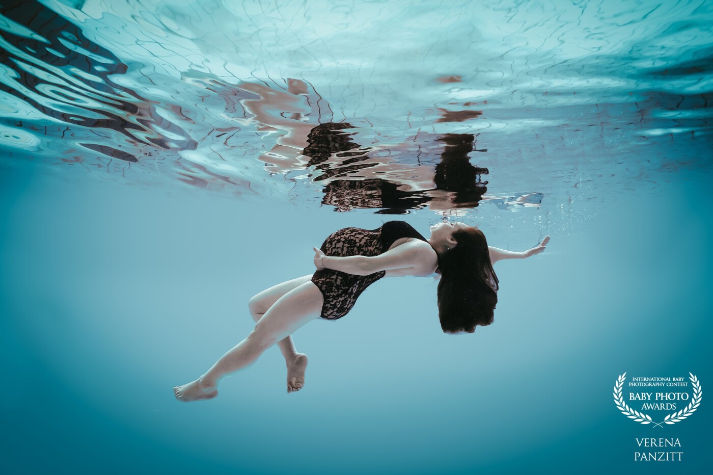Underwater is such a unique way to photograph a woman. The weightlessness allows the woman to float and present her body in a elegant, graceful and uniquely way. The pregnant woman floating in the water can also achieve the idea of the gracefulness and maternal image of her unborn baby that floats on her womb.