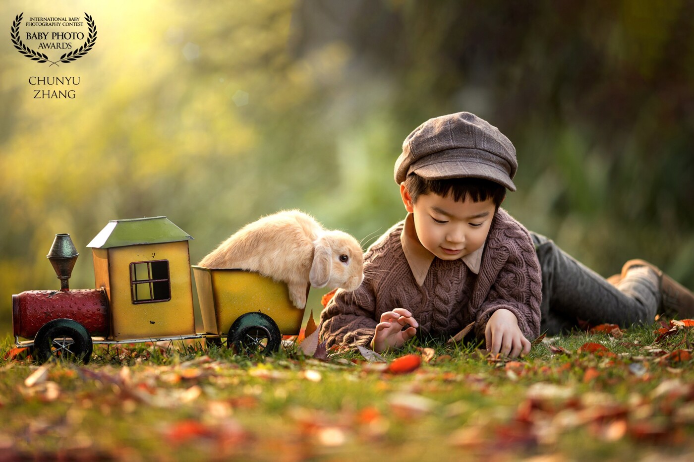 The little boy put the bunny in a nice yellow toy car and played with the bunny.The little rabbit also stuck his head out and looked at the ground with him. They were having a really good time together.