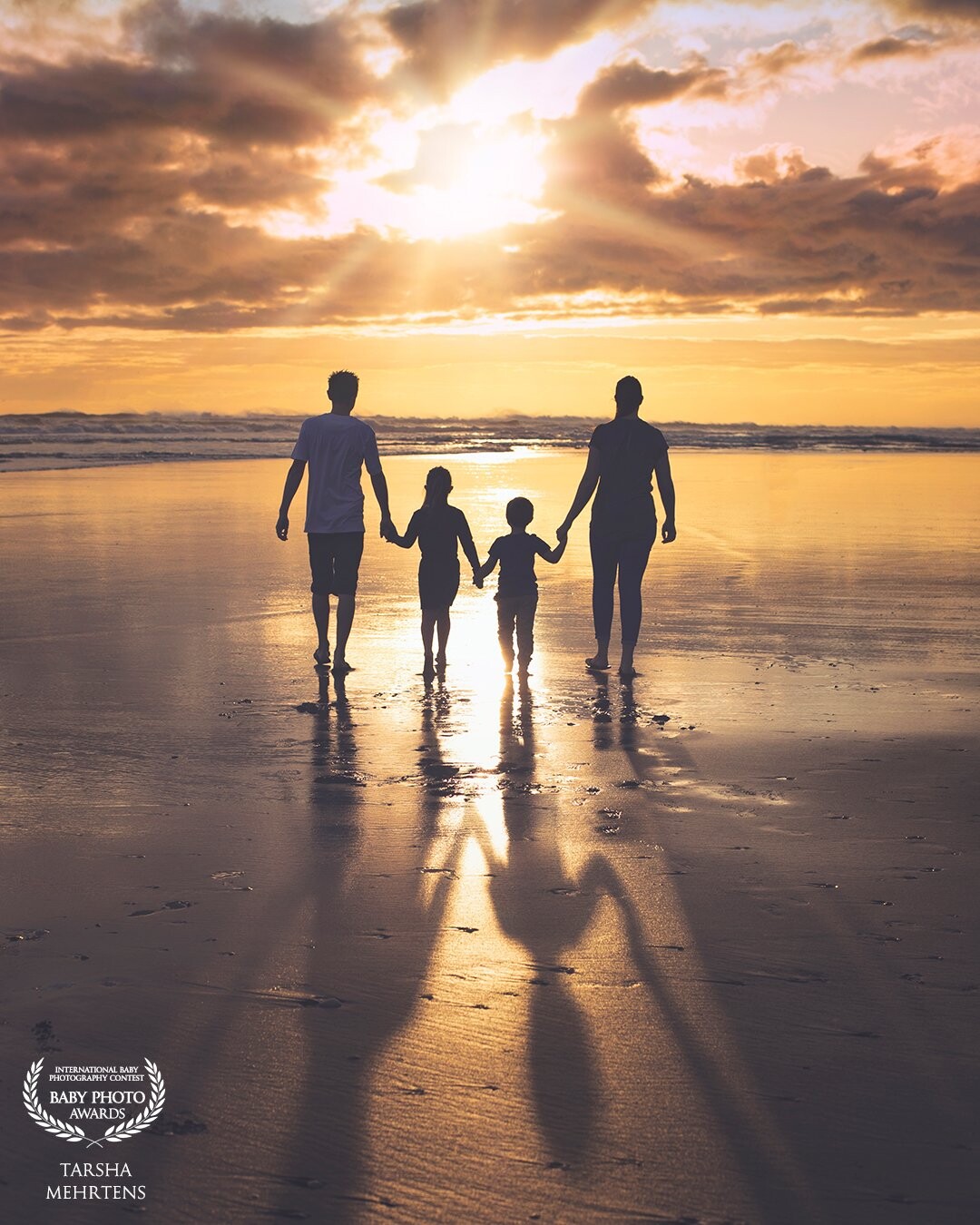 The perfect sunset for this family at Kariotahi Beach, NZ. The best way to end a day, creating memories.