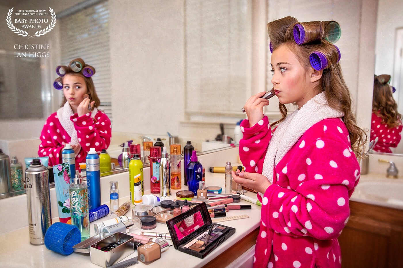 As a young girl, I remember sneaking into my Mom's makeup and styling products to use on myself. It made me feel so grown up. This young girl of 9 years old adores her Mom and is having so much fun exploring all her mom's beauty product treasures.