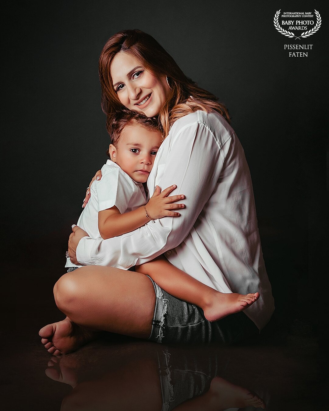 The best refuge of a child is the arms of his mum.<br />
We can feel how strong and how deep <br />
is the connexion between them in my photo.
