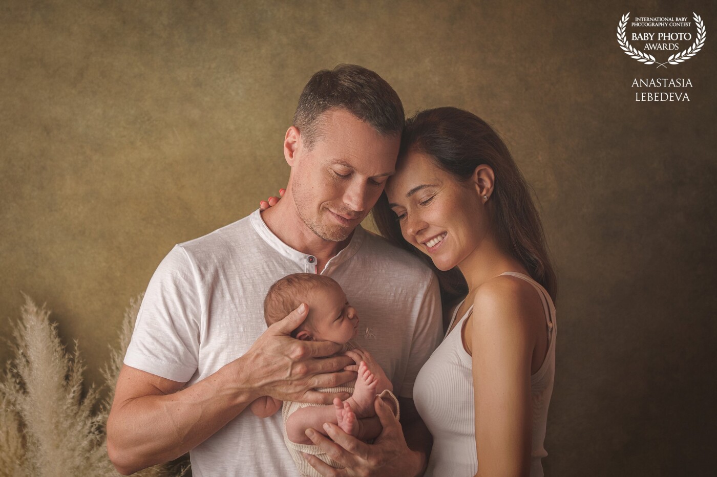 This photo captures happiness. The happiness of parents is in the hands of those who have a new life. Little newborn baby. Love and harmony and this is happiness.