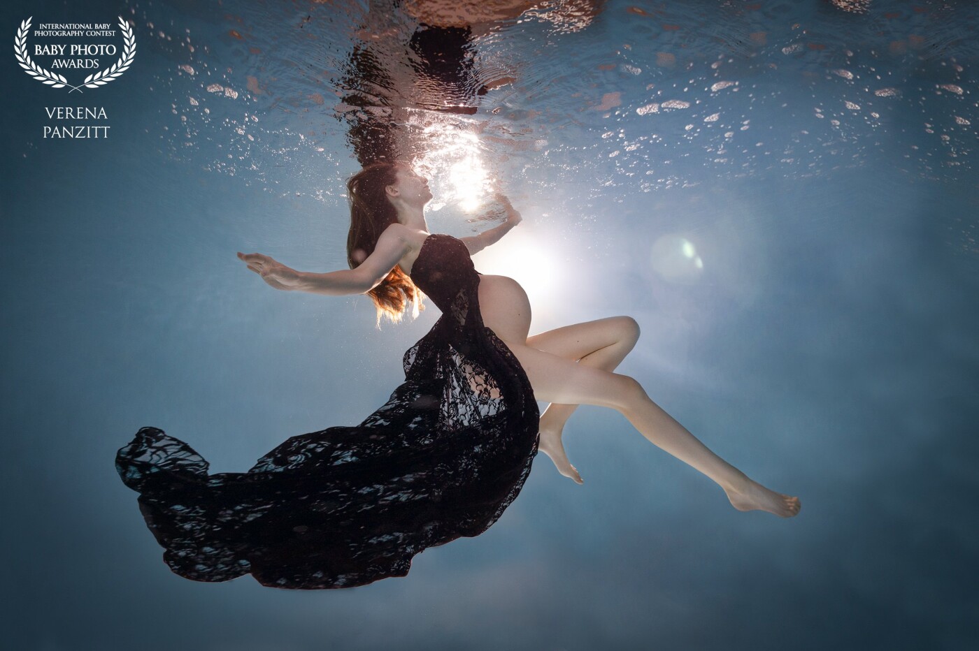 Underwater is such a unique way to photograph a woman. The weightlessness allows the woman to float and present her body in a elegant, graceful and uniquely way. The pregnant woman floating in the water can also achieve the idea of the gracefulness and maternal image of her unborn baby that floats on her womb.