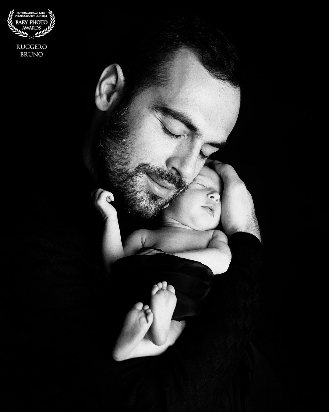 The first hug                             <br />
<br />
Daddy's arms are the safest place the little one knows! <br />
A shot to never forget . . .