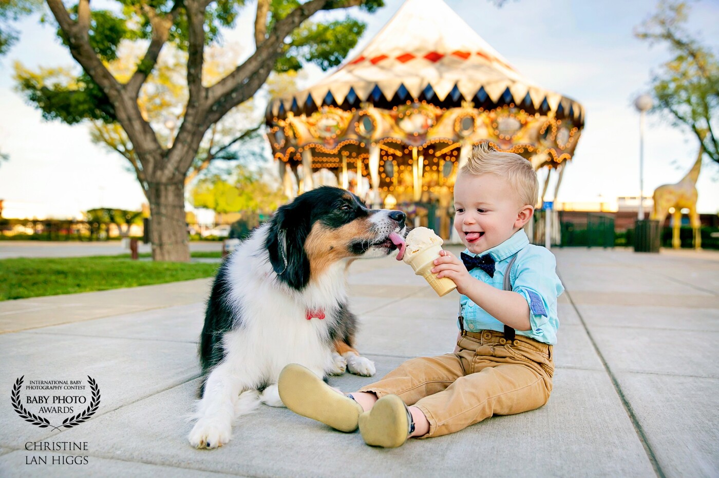 Sharing an ice cream on a warm day with your best friend is the best! This was photographed at the Nut Tree,  which opened in 1921 as a modest roadside stop in Vacaville, CA, eventually growing to become a world-famous road stop with a restaurant, toy store, and railroad connecting to the Nut Tree Airport. Over 100 years later, it is still a fun place for families to make memories such as this one of Logan (age 2) and Eli (cute dog).