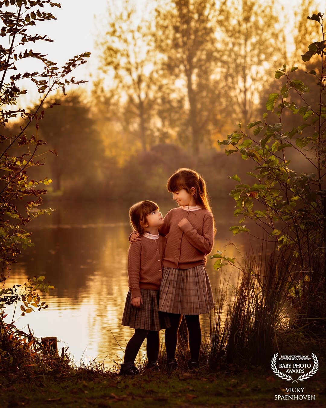 These two, my girls ;-). They are six and three years old. It was a beautiful autumn evening, so we've captured that beautiful light and their connection. It's such a magical image for me. Thank you for chosing this one.