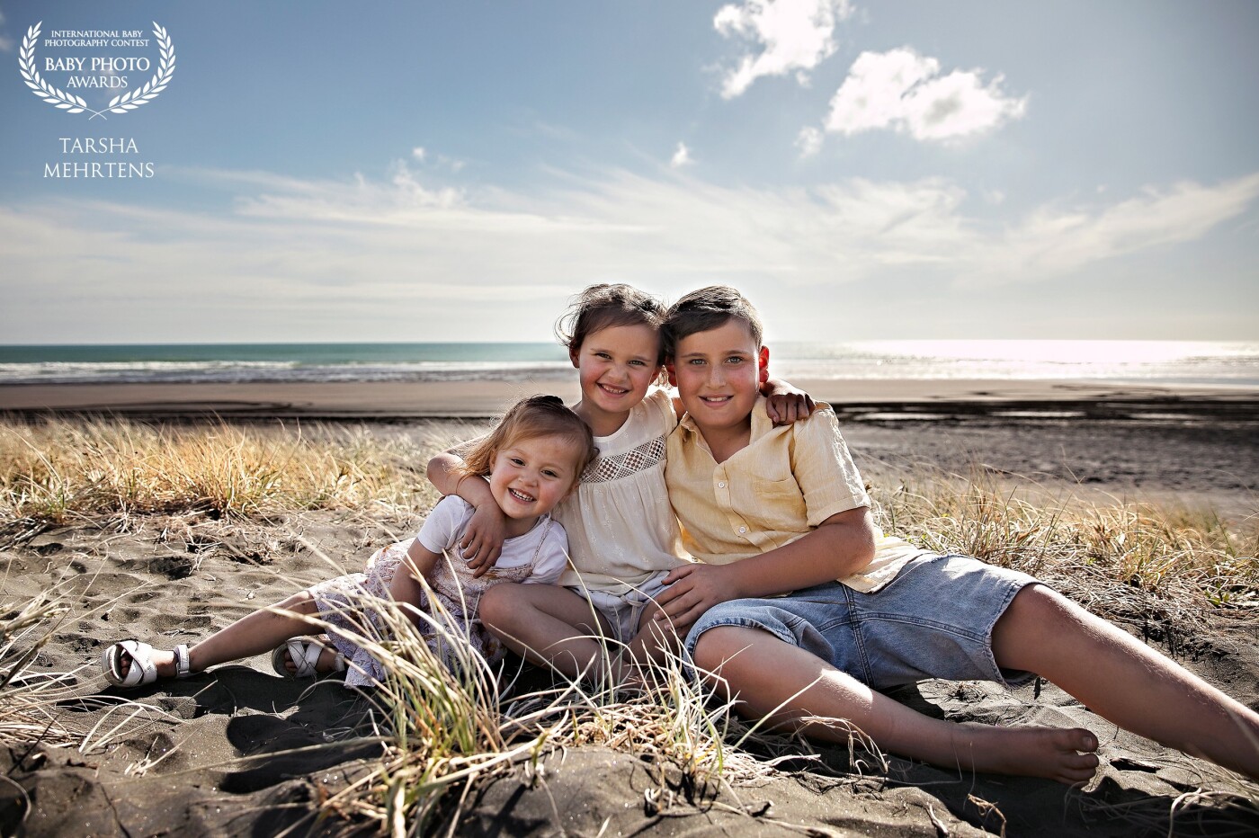 Siblings! A gorgeouse evening at Kariotahi Beach, NZ with these kids, it was still and the sun was shining, perfect for their session.