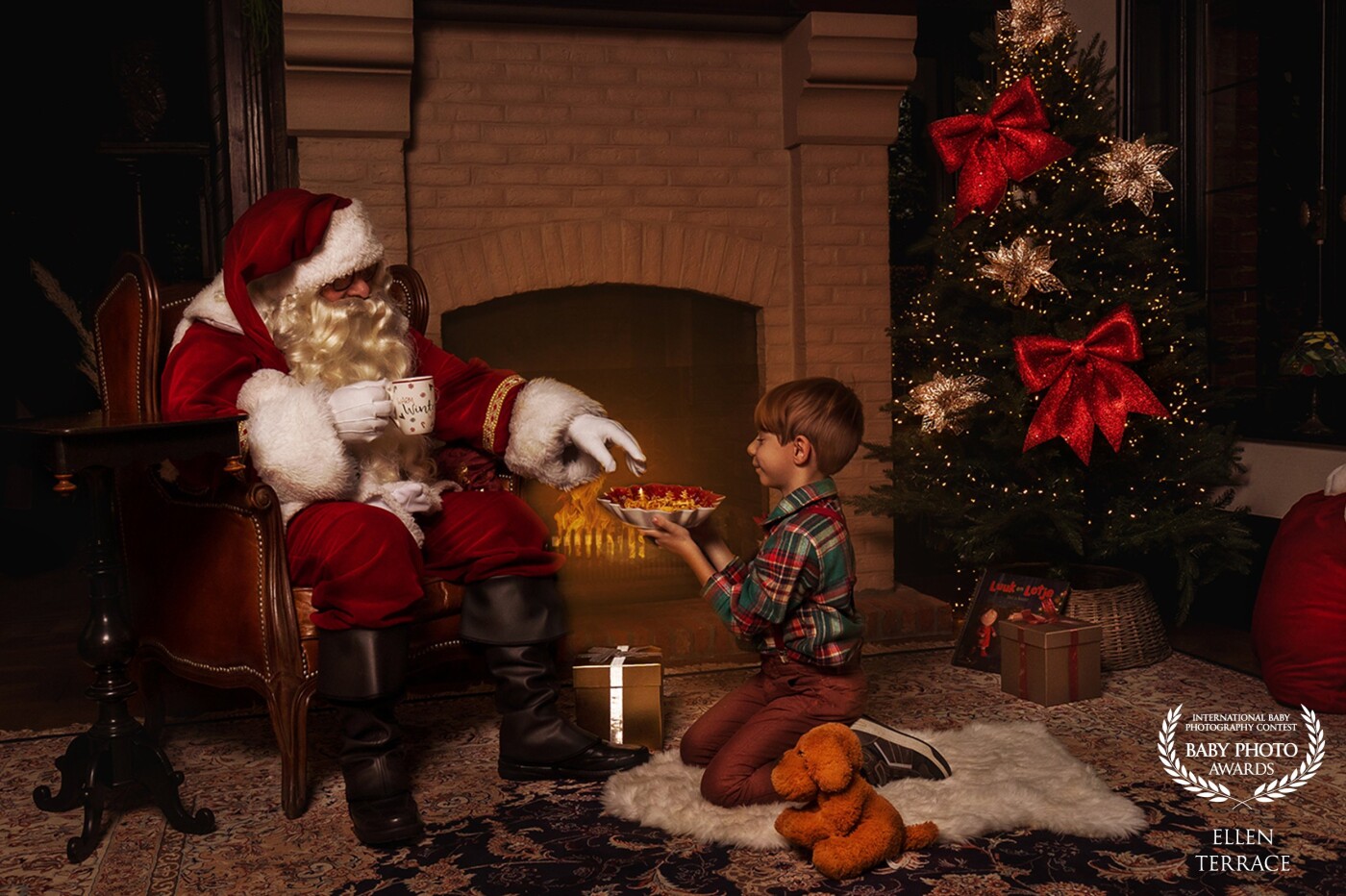 This photograph is one of a series I made for this Christmas.<br />
I love that you can almost feel the warmth in this picture. I can hear the fire cracking; I can feel the happiness that the boy feels after he got his presents. I just love looking at it. <br />
Fun fact: Santa was portraited by the boy’s grandfather!<br />
<br />
Thank you so much for this honour!