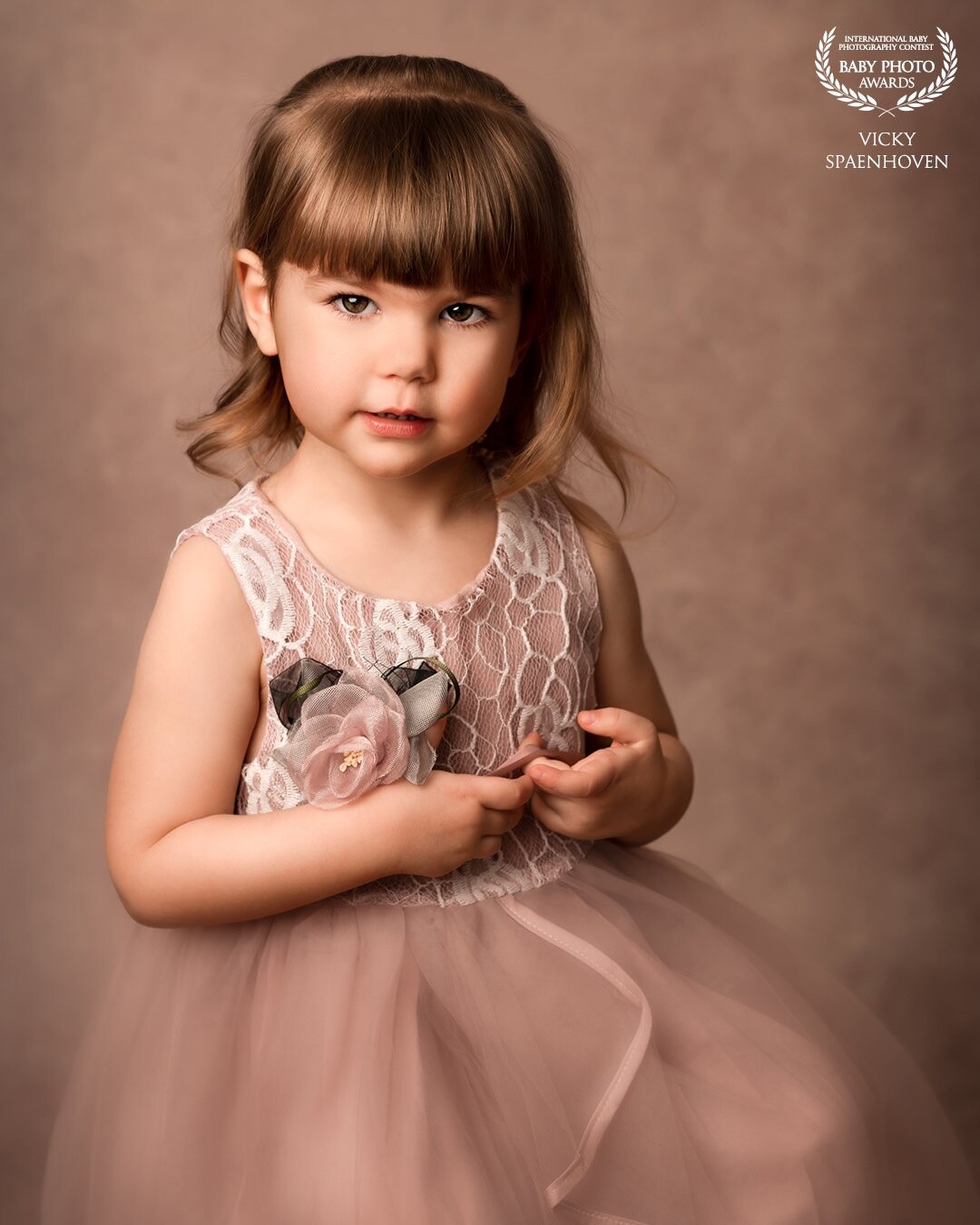 My youngest daughter Maëlle, almost 4 years old. I’d love to make a studio portrait of my kids once and a while. It’s so great to see their growth through the years. And I love her innocent expression in this image.