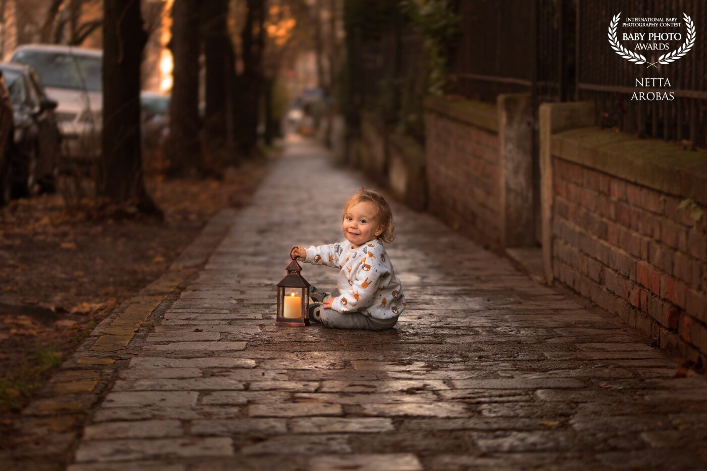 Autumn is lantern time! When the day looks dark, a small light goes a long way.<br />
Who shines brighter- the candle light or this sweet little boy?