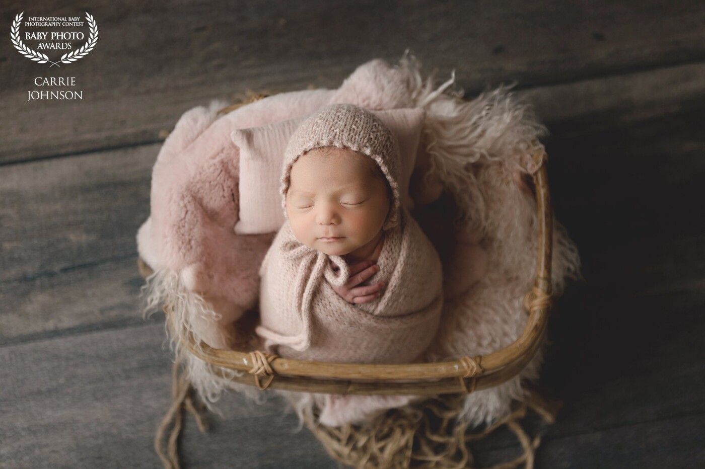 This little girl came into the studio at just 5 days old. She slept like a angel and looked so pretty all wrapped up in this pink setup.